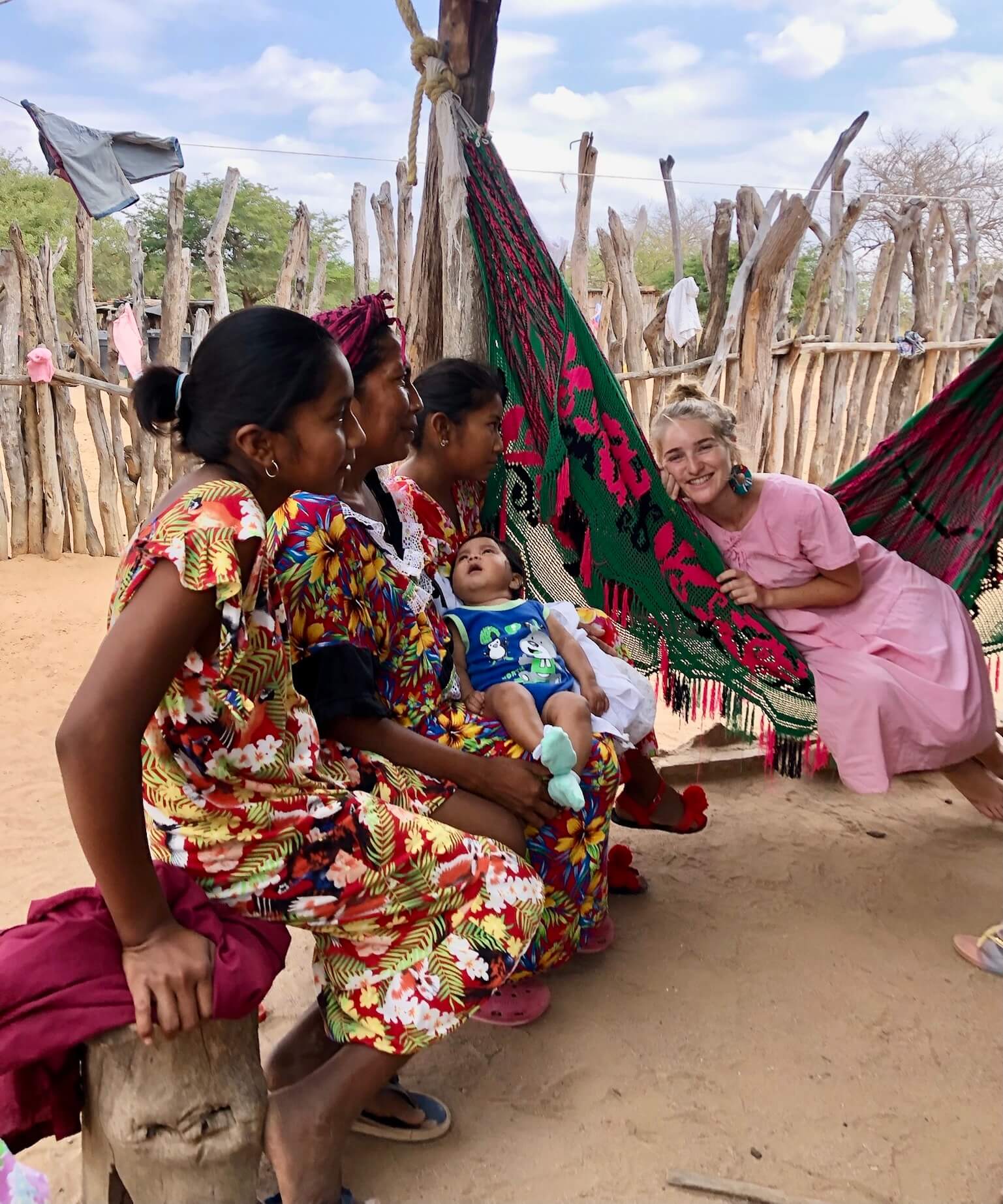 Wayuu women and cofounder sitting in a traditional "chinchorro" hammock