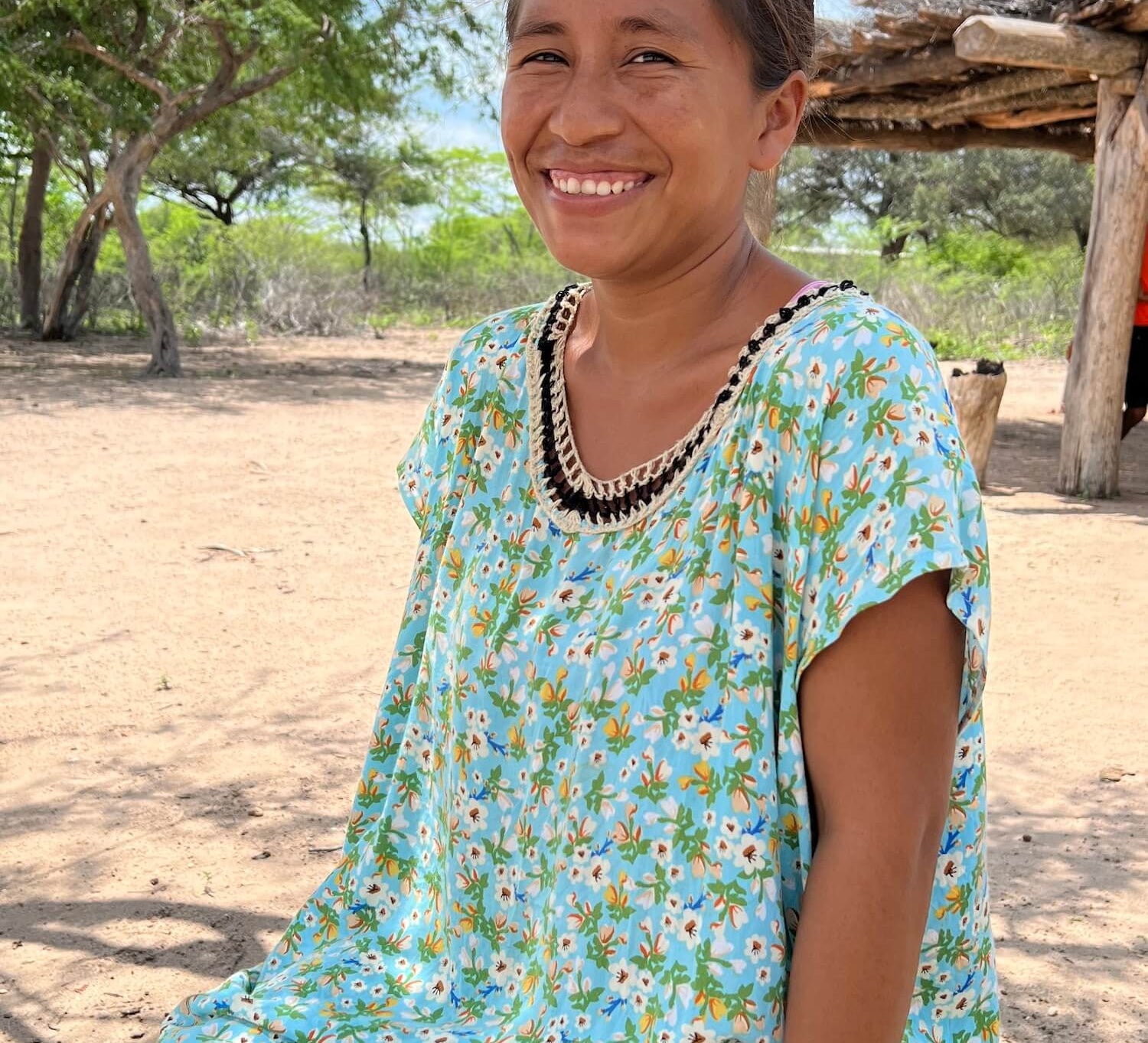 Wayuu woman in colourful "manta" dress in a rural village