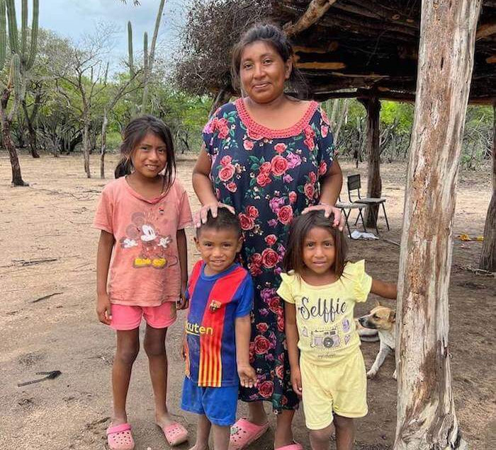 Wayuu women and her family in an Indigenous village