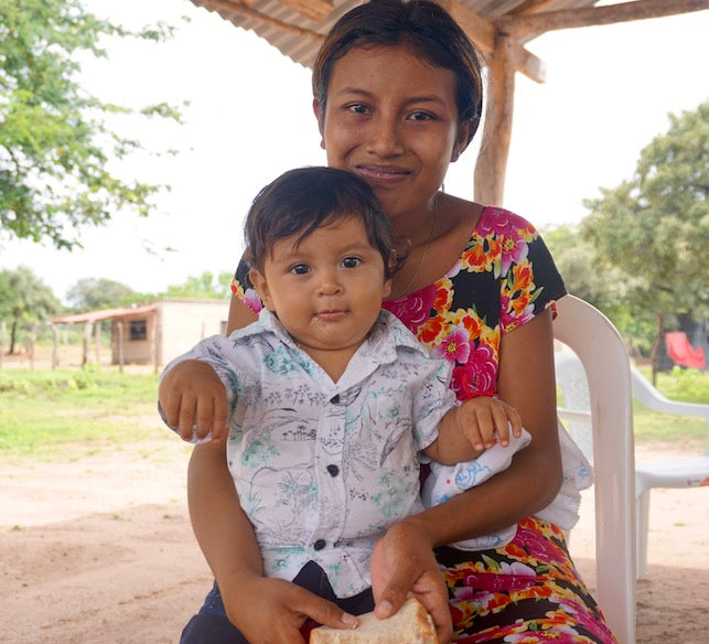 Young Wayuu woman and her child in Indigenous village