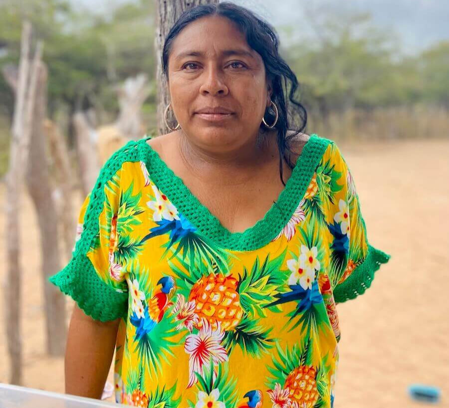 Wayuu women in a traditional bright yellow "manta" dress