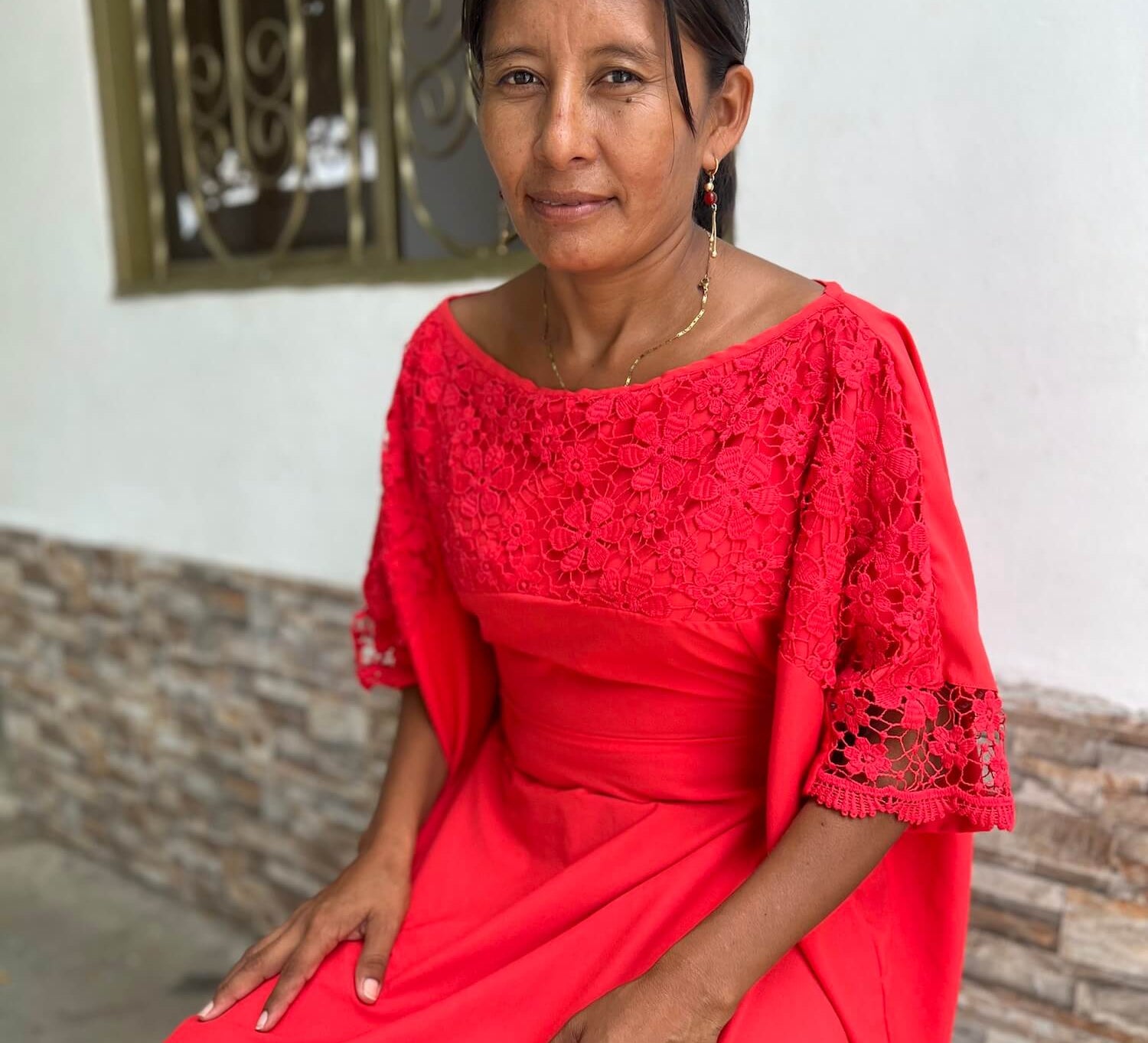 Wayuu woman in a red traditional "manta" dress