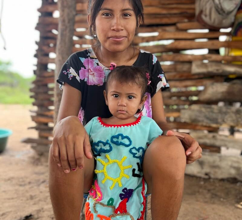 Young Wayuu woman and her child in a rural village