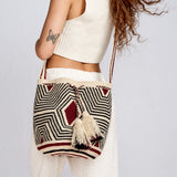 girl posing with a traditional Wayuu crossbody mochila