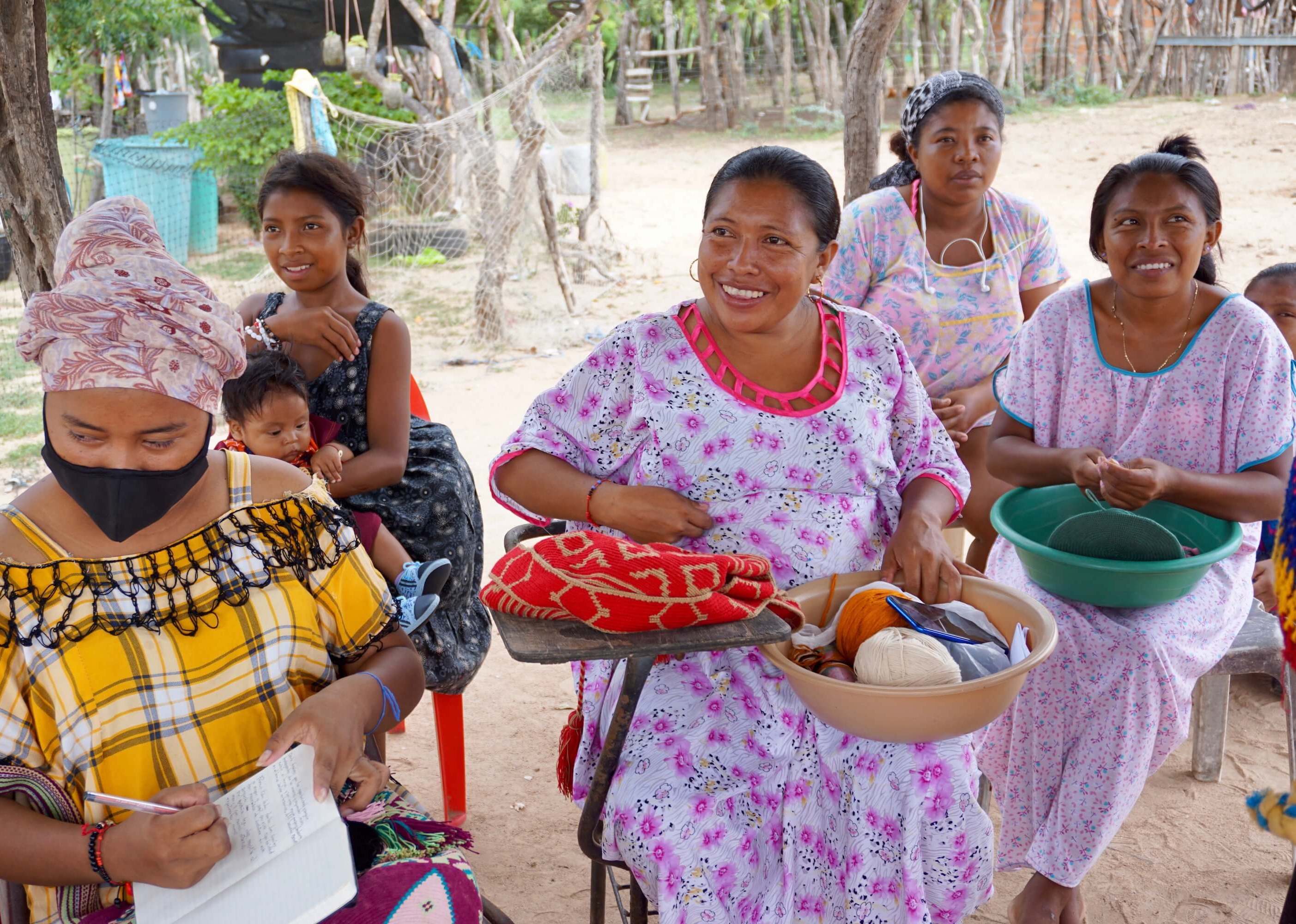 Wayuu women smiling during a community workshop