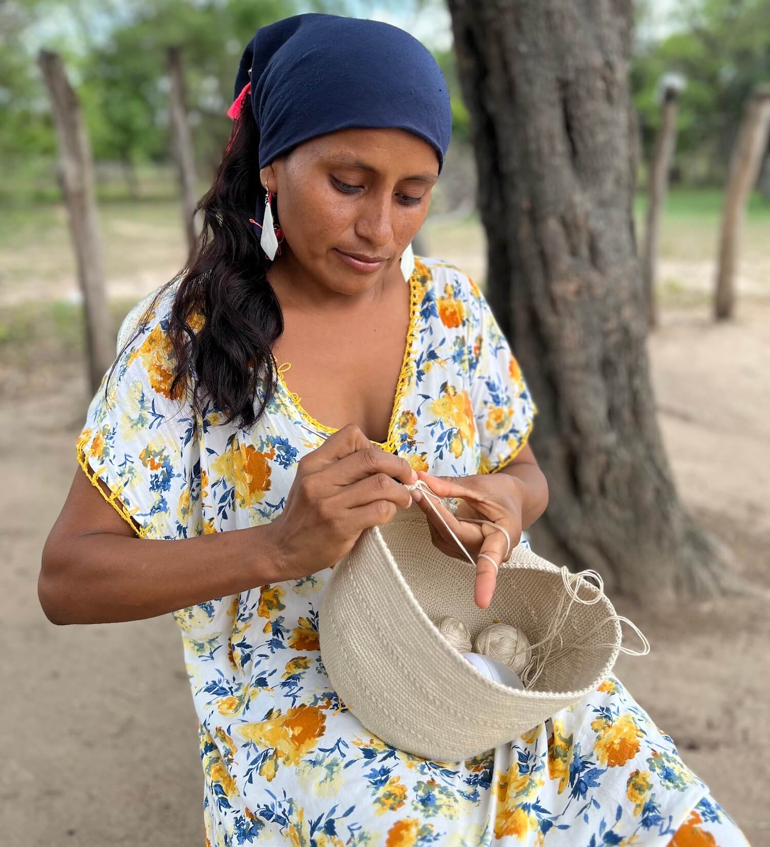 Wayuu woman crocheting a mochila crossbody bag